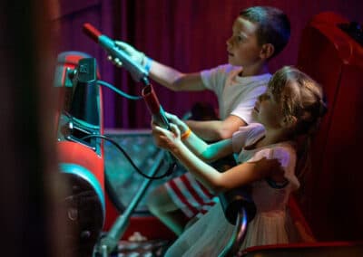Two youth interacting with the storyline in the Whispering Pines Haunted Hotel Dark Ride at Funtown USA